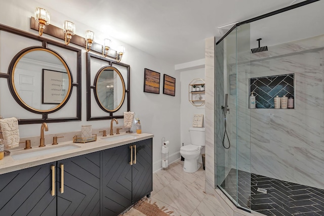 bathroom featuring vanity, toilet, and a shower with shower door