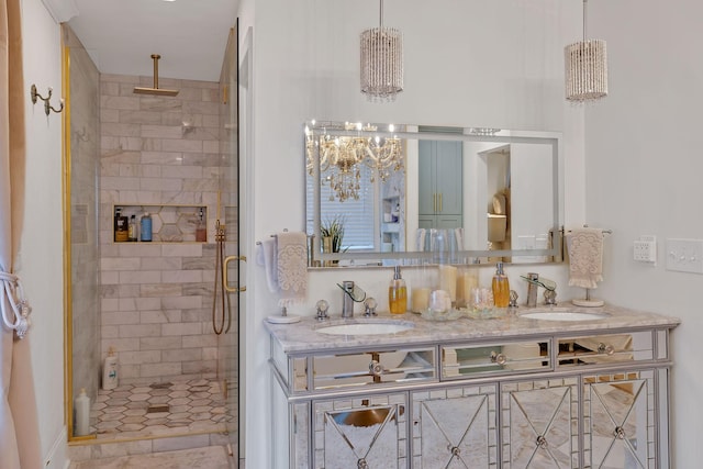 bathroom featuring vanity and a shower with shower door