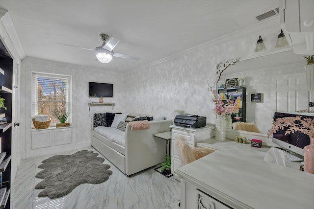 living room with ceiling fan and ornamental molding