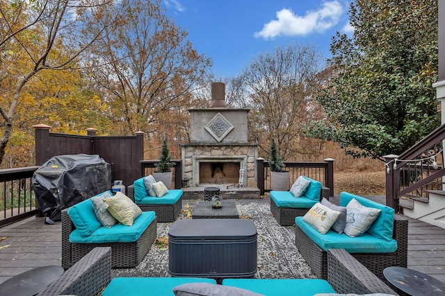 wooden deck with an outdoor living space with a fireplace and a grill