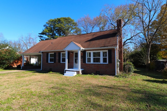 view of front facade featuring a carport and a front yard