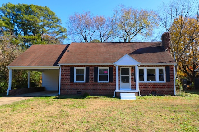 view of front facade with a carport and a front yard