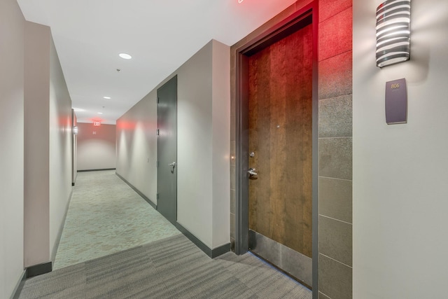 hallway with light colored carpet