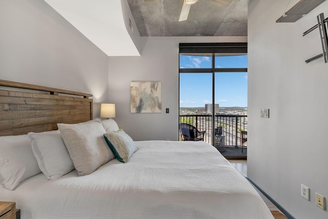 bedroom featuring ceiling fan, access to exterior, and wood-type flooring