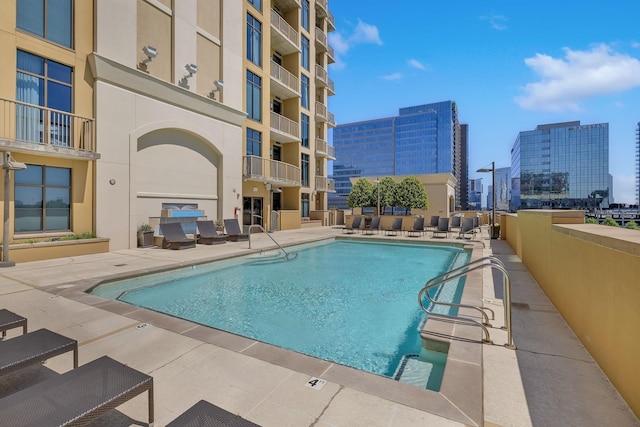 view of swimming pool with a patio