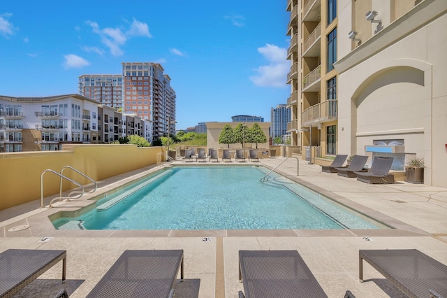 view of swimming pool featuring a patio area