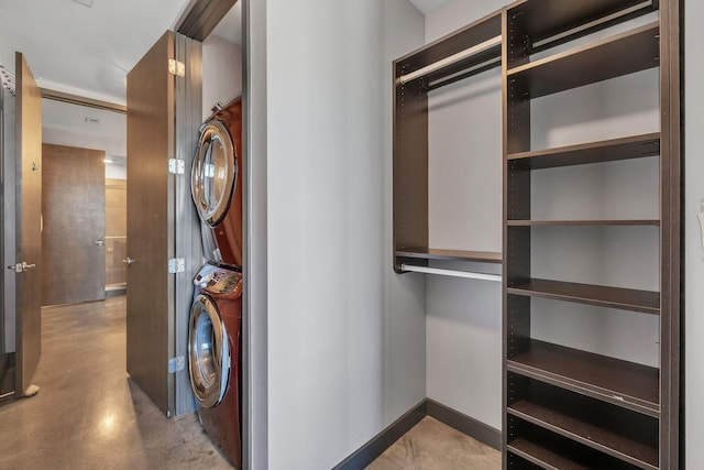 washroom with stacked washer and dryer