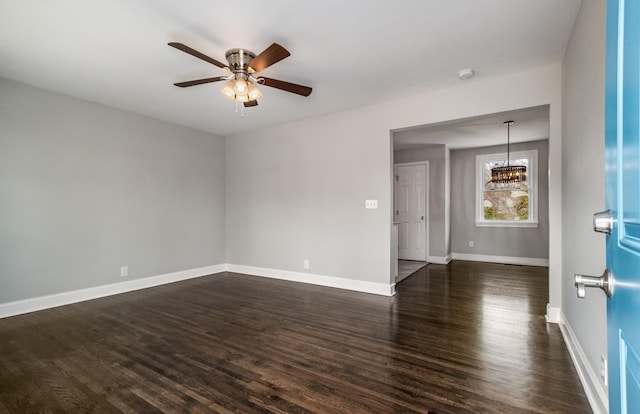 unfurnished room with ceiling fan and dark hardwood / wood-style floors