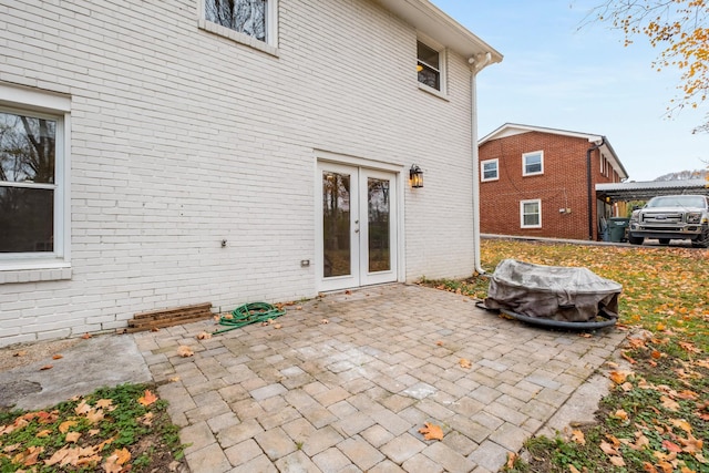 back of property with a patio area and french doors