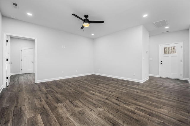 spare room featuring visible vents, baseboards, recessed lighting, ceiling fan, and dark wood-type flooring