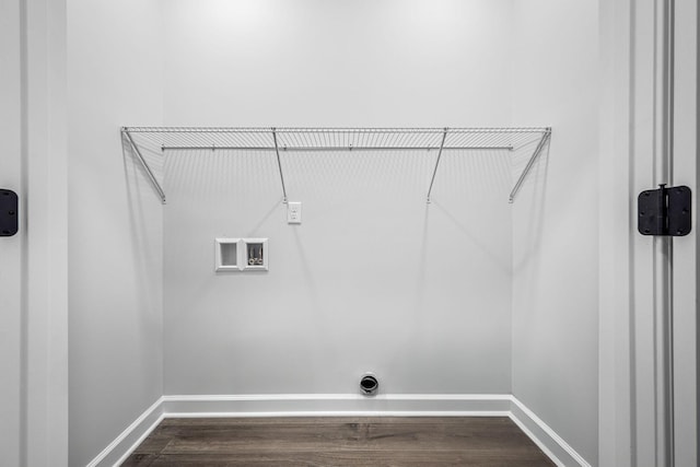 washroom with laundry area, dark wood-type flooring, baseboards, and washer hookup