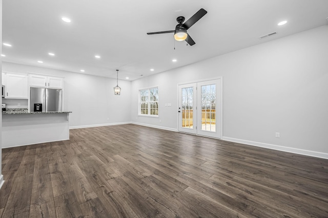 unfurnished living room with visible vents, recessed lighting, dark wood-type flooring, and ceiling fan