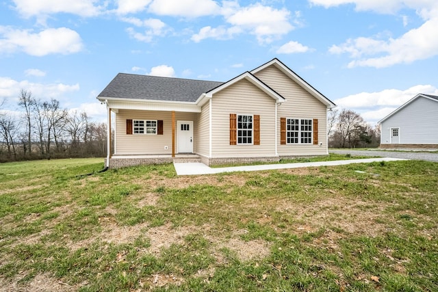 view of front of home with a porch, a shingled roof, and a front lawn