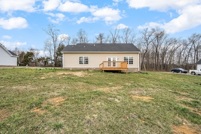 back of house featuring a yard and a wooden deck