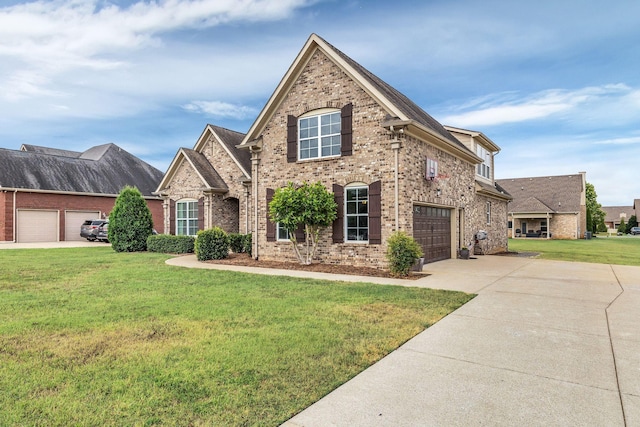 view of property with a front lawn and a garage