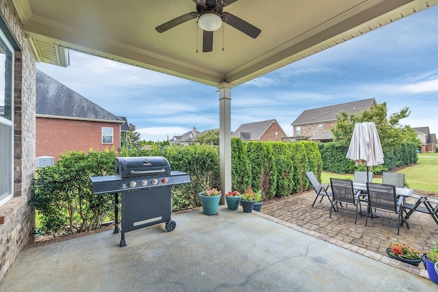 view of patio with ceiling fan and area for grilling