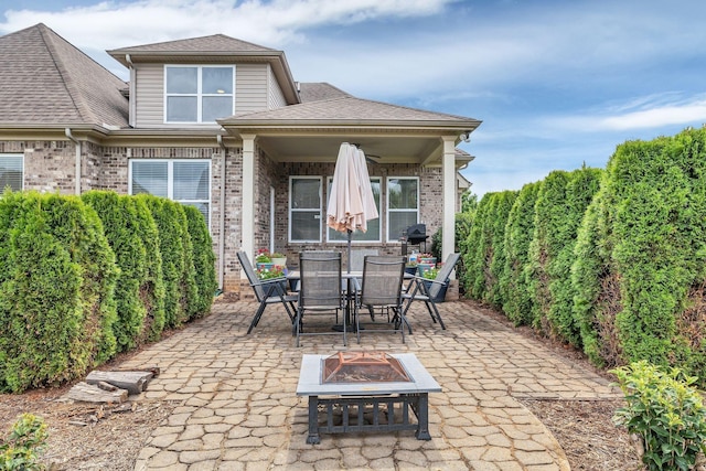 view of patio with an outdoor fire pit