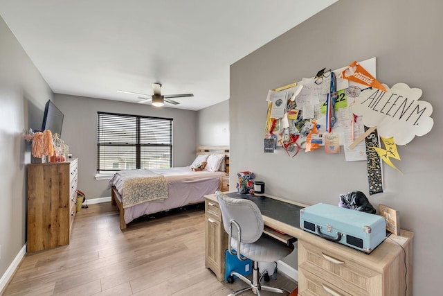 bedroom with ceiling fan and light hardwood / wood-style flooring