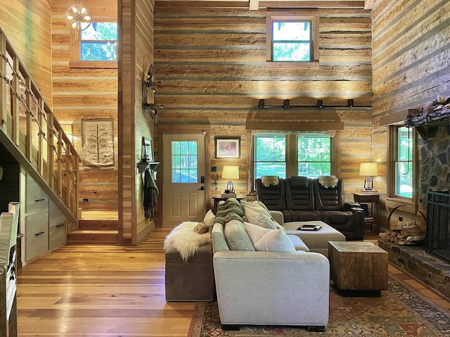 living room featuring a healthy amount of sunlight and a high ceiling