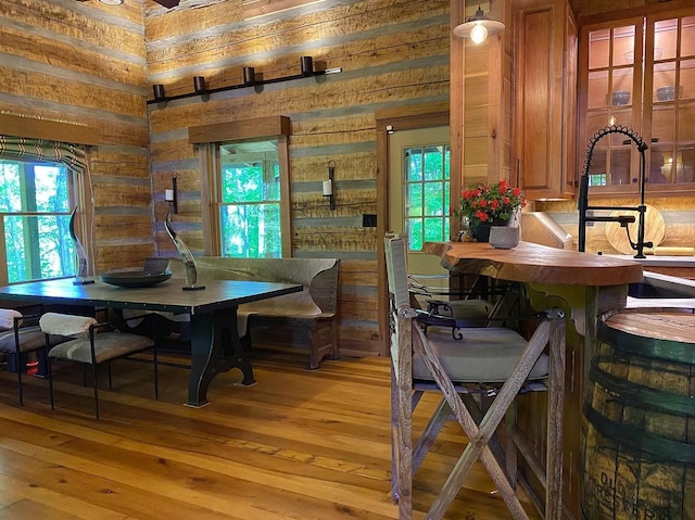 dining room with plenty of natural light and light wood-type flooring