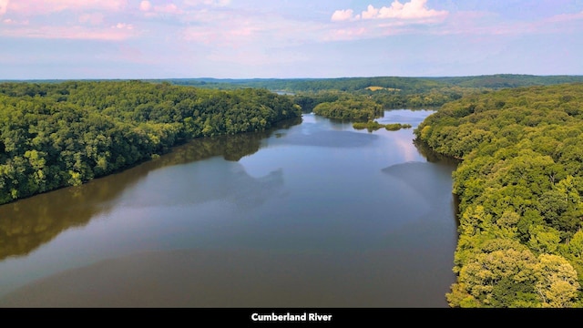 aerial view at dusk with a water view