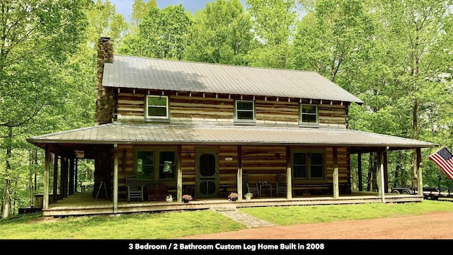 log-style house with a porch