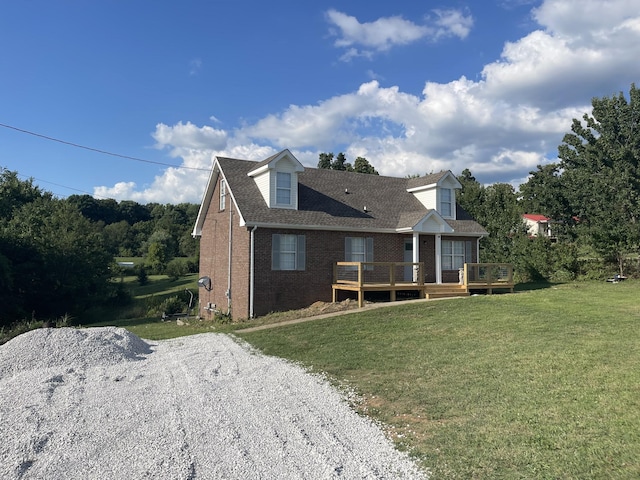 back of property with a lawn and a wooden deck