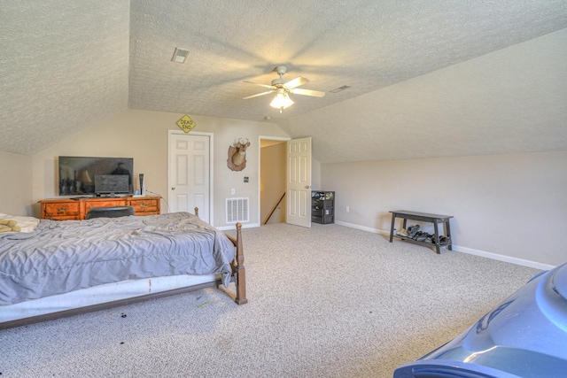 bedroom with carpet flooring, ceiling fan, lofted ceiling, and a textured ceiling