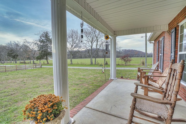 view of patio with a rural view and a porch