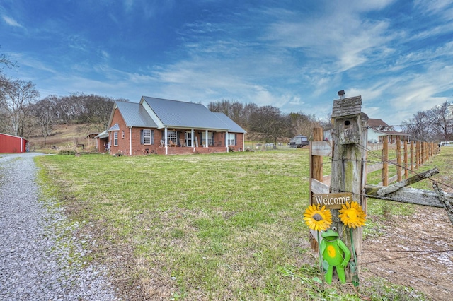 view of front of home featuring a front lawn and covered porch