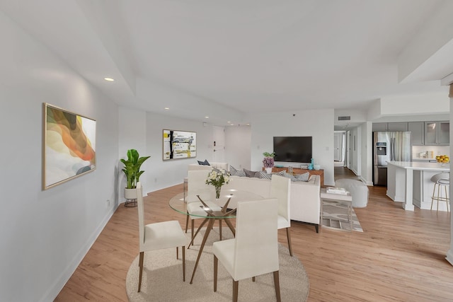 dining room with light hardwood / wood-style floors