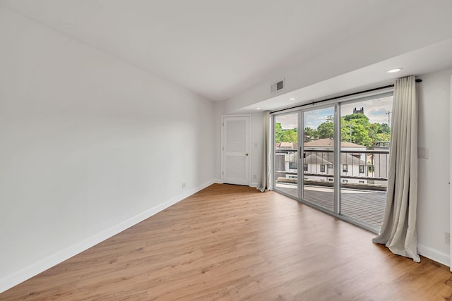 spare room with light hardwood / wood-style flooring