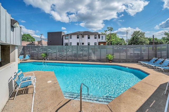 view of swimming pool with a patio