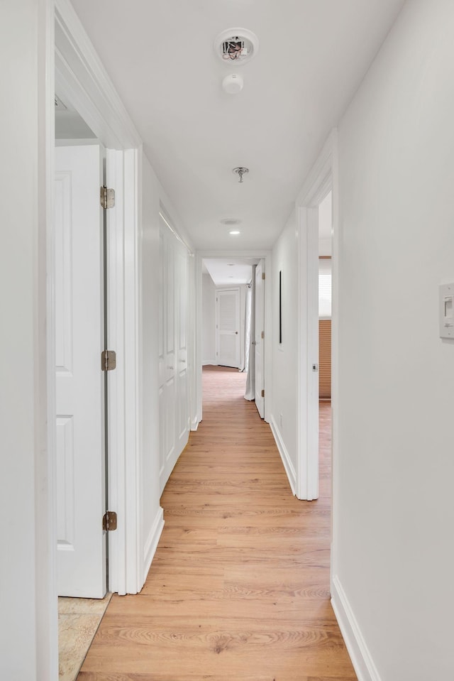 corridor featuring light wood-type flooring