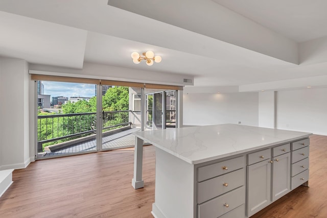 kitchen featuring a center island, light hardwood / wood-style floors, and plenty of natural light