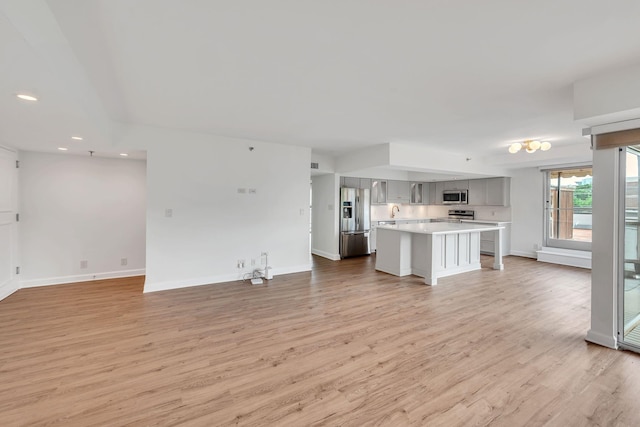 unfurnished living room with light wood-type flooring