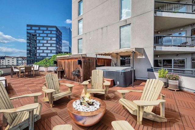 wooden deck with a fire pit