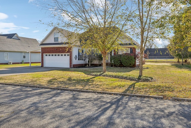 view of front of property with aphalt driveway, a garage, brick siding, fence, and a front lawn