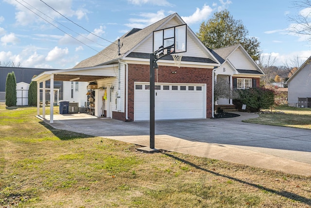 view of front facade with roof with shingles, a front yard, concrete driveway, and brick siding