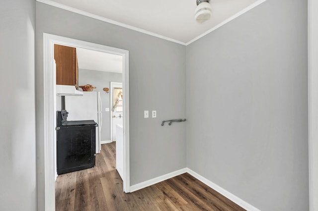 hallway with wood-type flooring and crown molding