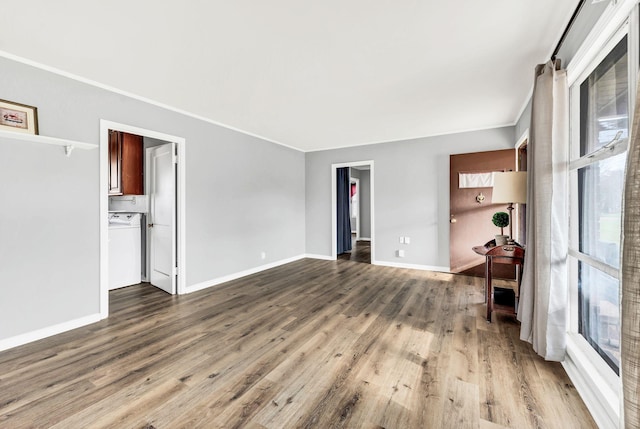 spare room featuring hardwood / wood-style floors and ornamental molding