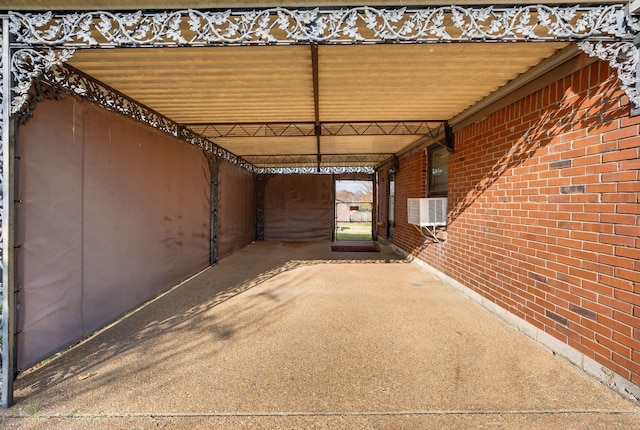 view of patio with cooling unit and a carport