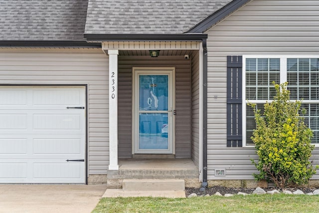 entrance to property featuring a garage