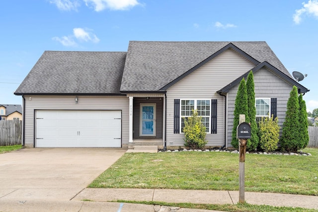 view of front of house featuring a garage and a front lawn