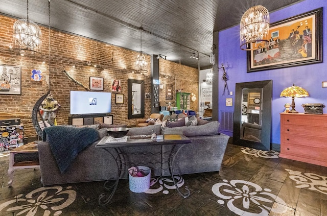 living room with rail lighting and brick wall