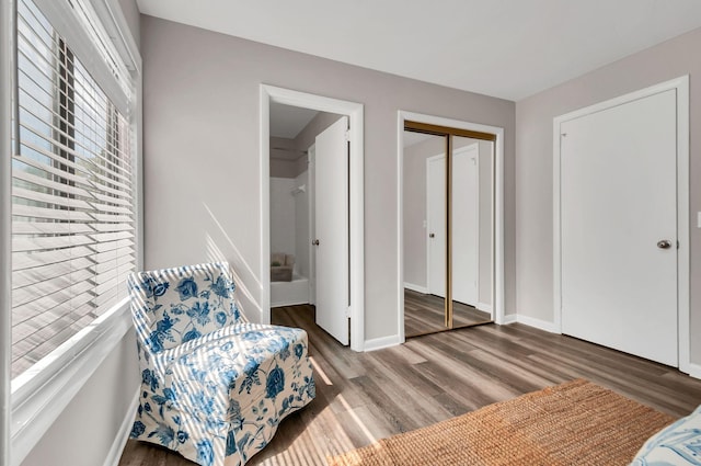 living area with hardwood / wood-style floors