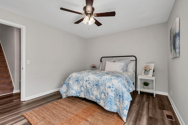 bedroom featuring ceiling fan and dark hardwood / wood-style flooring