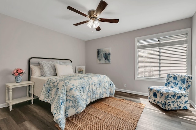 bedroom featuring ceiling fan and dark hardwood / wood-style floors