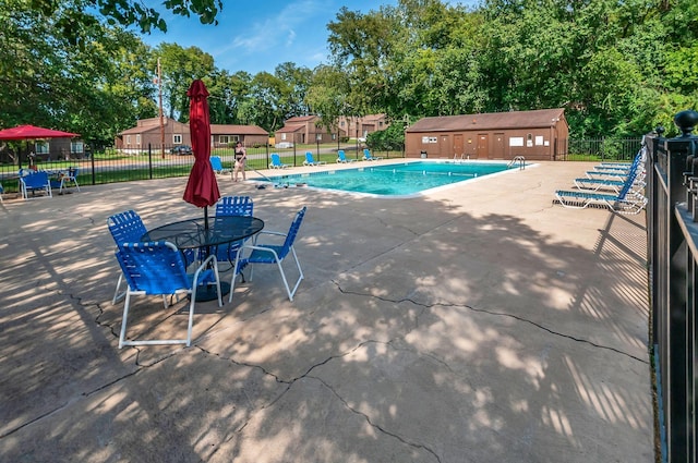 view of swimming pool featuring a patio area