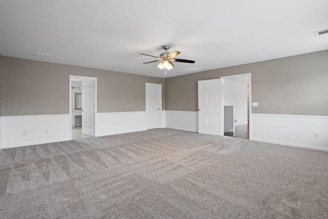 carpeted empty room with ceiling fan